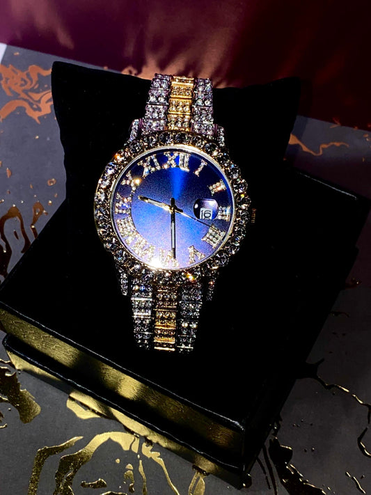 Blue dial Roman numeral iced watch with two-tone bracelet and crystal bezel – luxury streetwear look