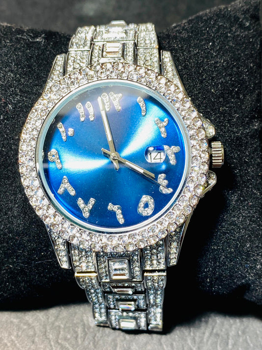 Silver iced-out watch with sapphire blue dial, crystal hour markers, and diamond bracelet – luxury streetwear timepiece