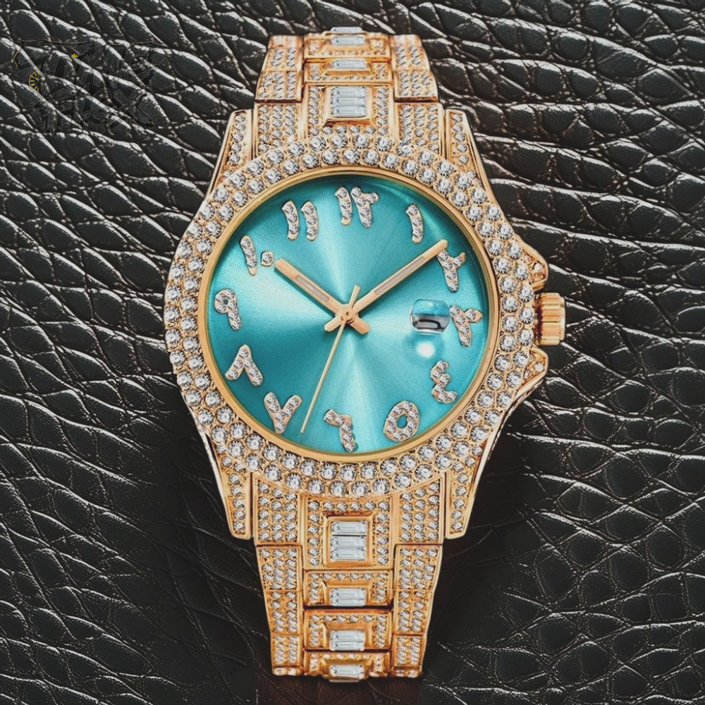 Gold-tone Men's women's watch with diamond-studded bezel, featuring a blue dial with crystal-encrusted Roman numerals and a date display. The watch has a glamorous, sparkling band with rectangular stones, offering a luxurious and stylish look.