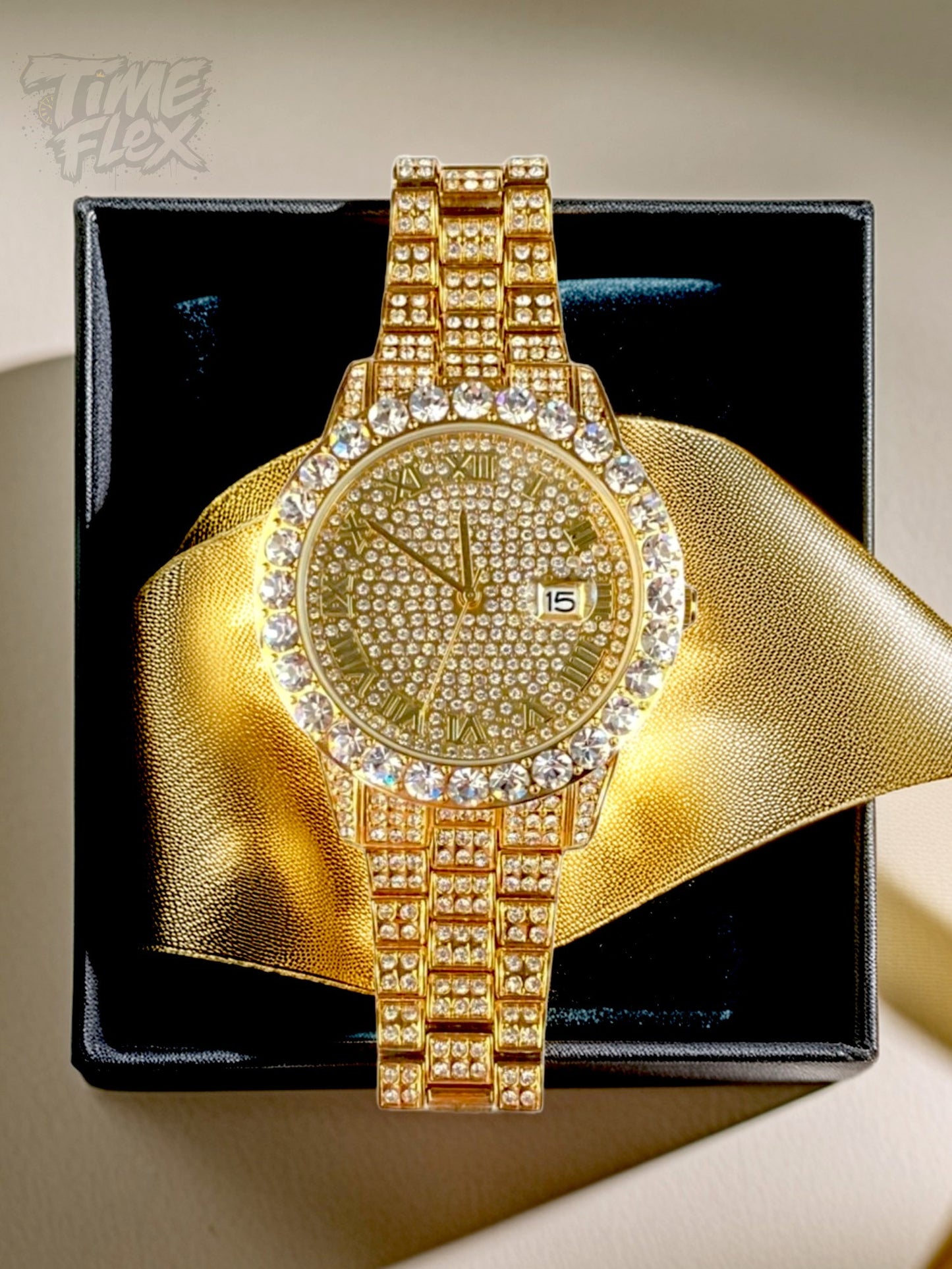 Gold-tone women's and men's watch with a diamond-studded bezel and a sparkling crystal-encrusted band. The watch features a textured gold dial, Roman numeral markers, and a date display at the 3 o'clock position, offering a luxurious and elegant look.