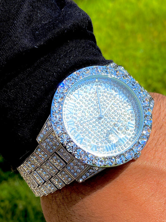 Silver iced-out watch with Roman numeral pavé dial and diamond bracelet – luxury streetwear timepiece