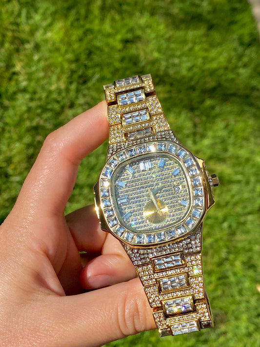 Gold iced-out watch with baguette bezel, grid pavé dial, and diamond bracelet – luxury streetwear timepiece