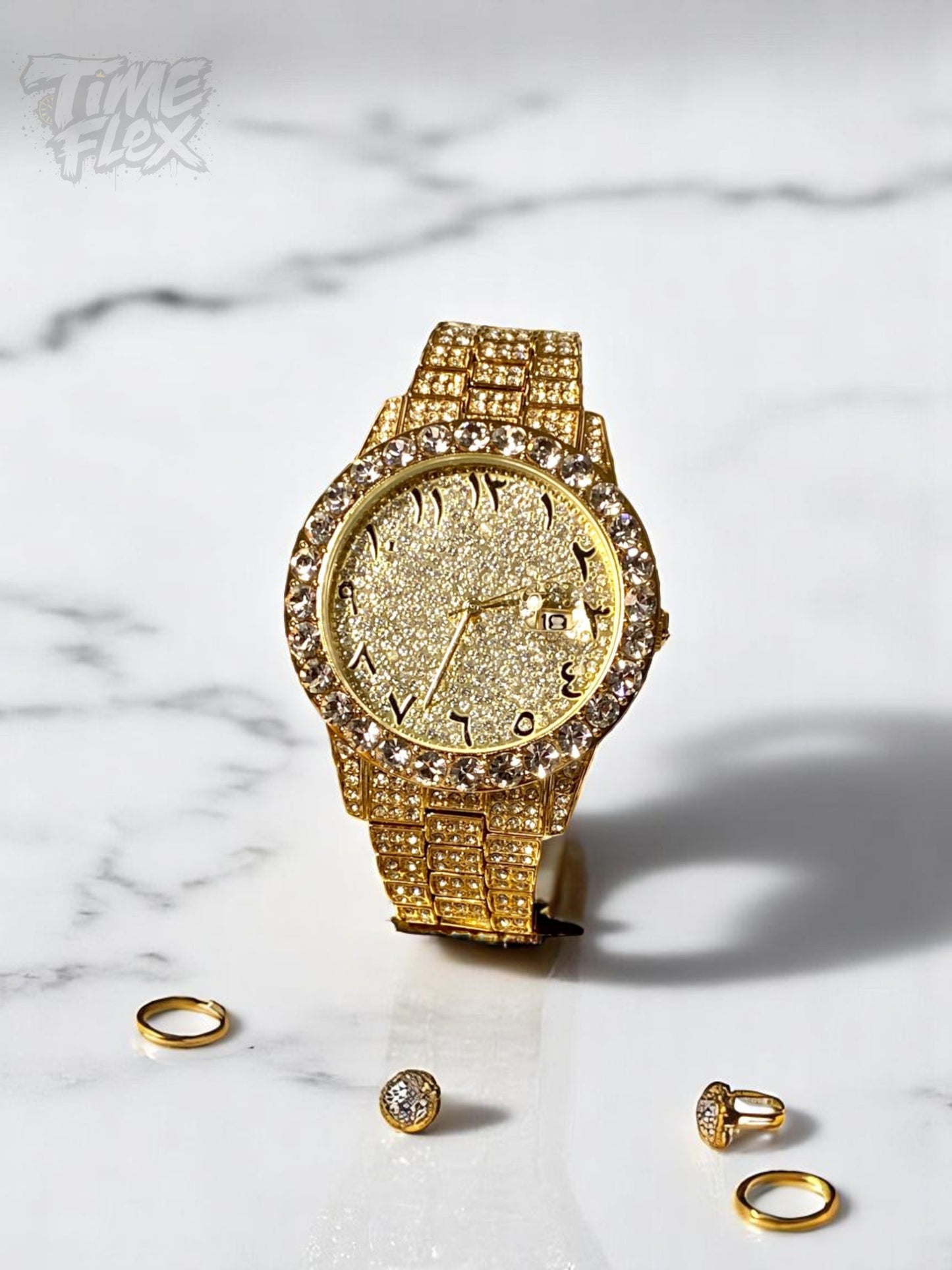 Gold-tone unisex watch with a sparkling, diamond-studded bezel and crystal-encrusted band. The watch features a glittering gold dial with unique Roman numerals and a date display, offering a luxurious and eye-catching look.
