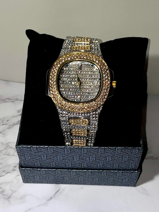 Two-tone iced-out watch with gold bezel, grid pavé dial, and diamond bracelet – luxury streetwear style