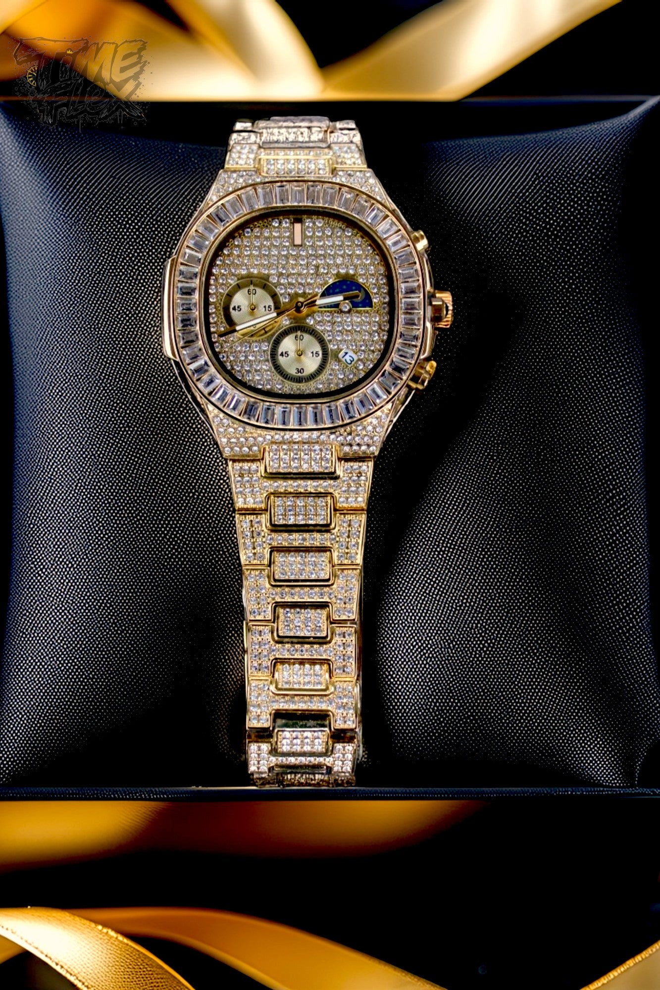 Gold-tone unisex watch with a diamond-studded dial and bezel. The watch features dual sub-dials, a moonphase display, and a sparkling crystal-encrusted band, offering a luxurious and high-end look.