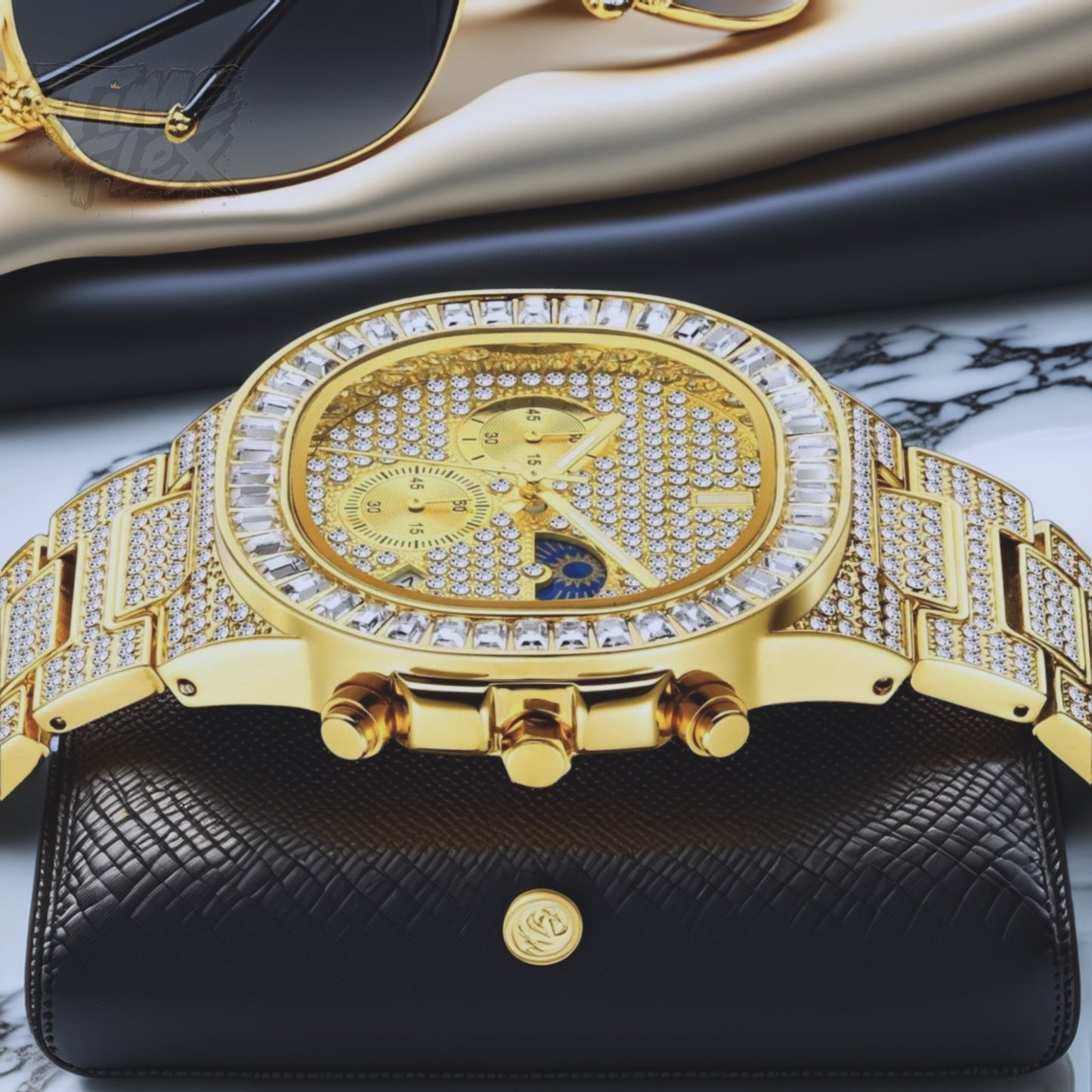 Gold-tone unisex watch with a diamond-studded dial and bezel. The watch features dual sub-dials, a moonphase display, and a sparkling crystal-encrusted band, offering a luxurious and high-end look.