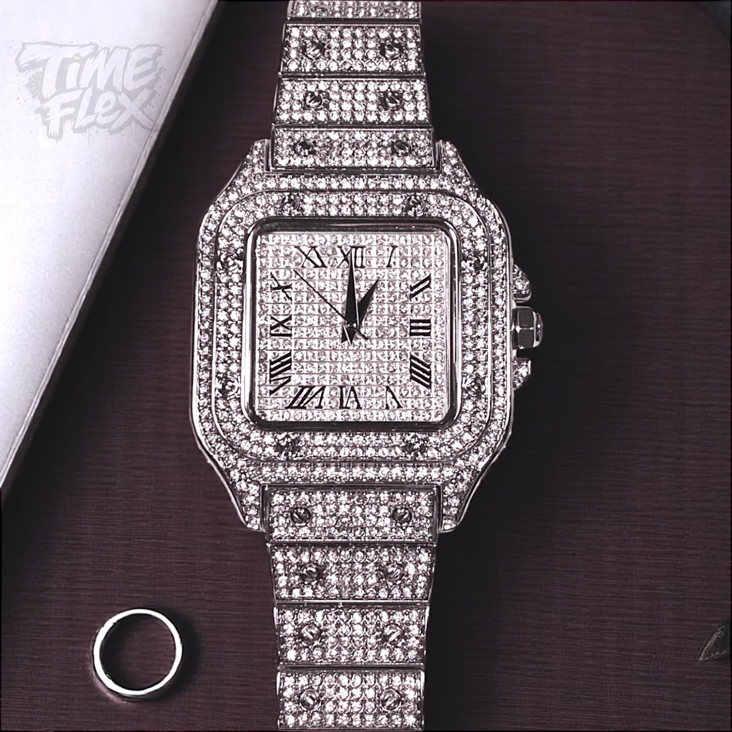 Silver-tone unisex watch with a square dial, crystal-encrusted bezel, and sparkling band. The watch features Roman numeral markers and a luxurious, diamond-studded design, offering a sleek and elegant look.