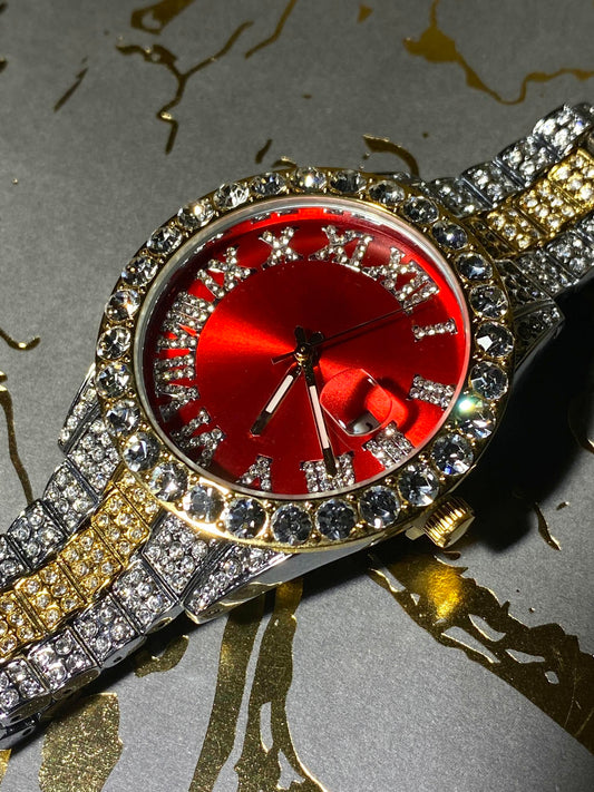 Two-tone iced-out watch with red dial, Roman numerals, and diamond bracelet – luxury streetwear timepiece