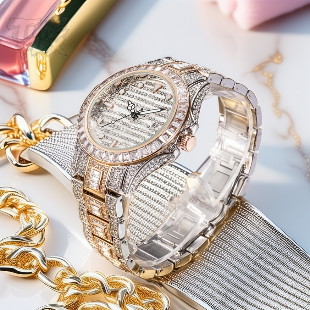 Silver and gold men's women's watch with a diamond-studded bezel and rectangular stone accents on the band. The watch features a sleek white dial with black hands and a date display.