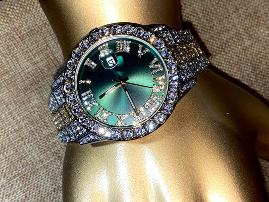 Two-tone iced-out watch with green Roman numeral dial and crystal bezel – luxury statement timepiece