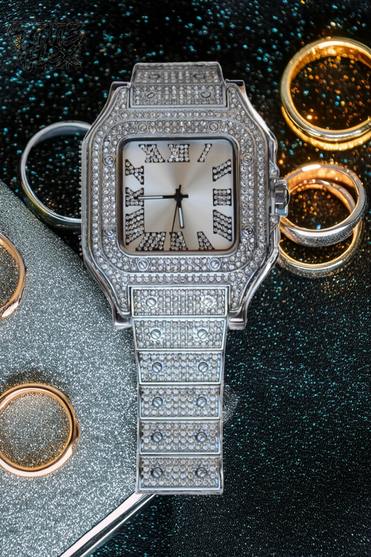 Silver-tone unisex watch with a square dial, crystal-encrusted bezel, and sparkling band. The watch features Roman numeral markers and a luxurious, diamond-studded design, offering a sleek and elegant look.