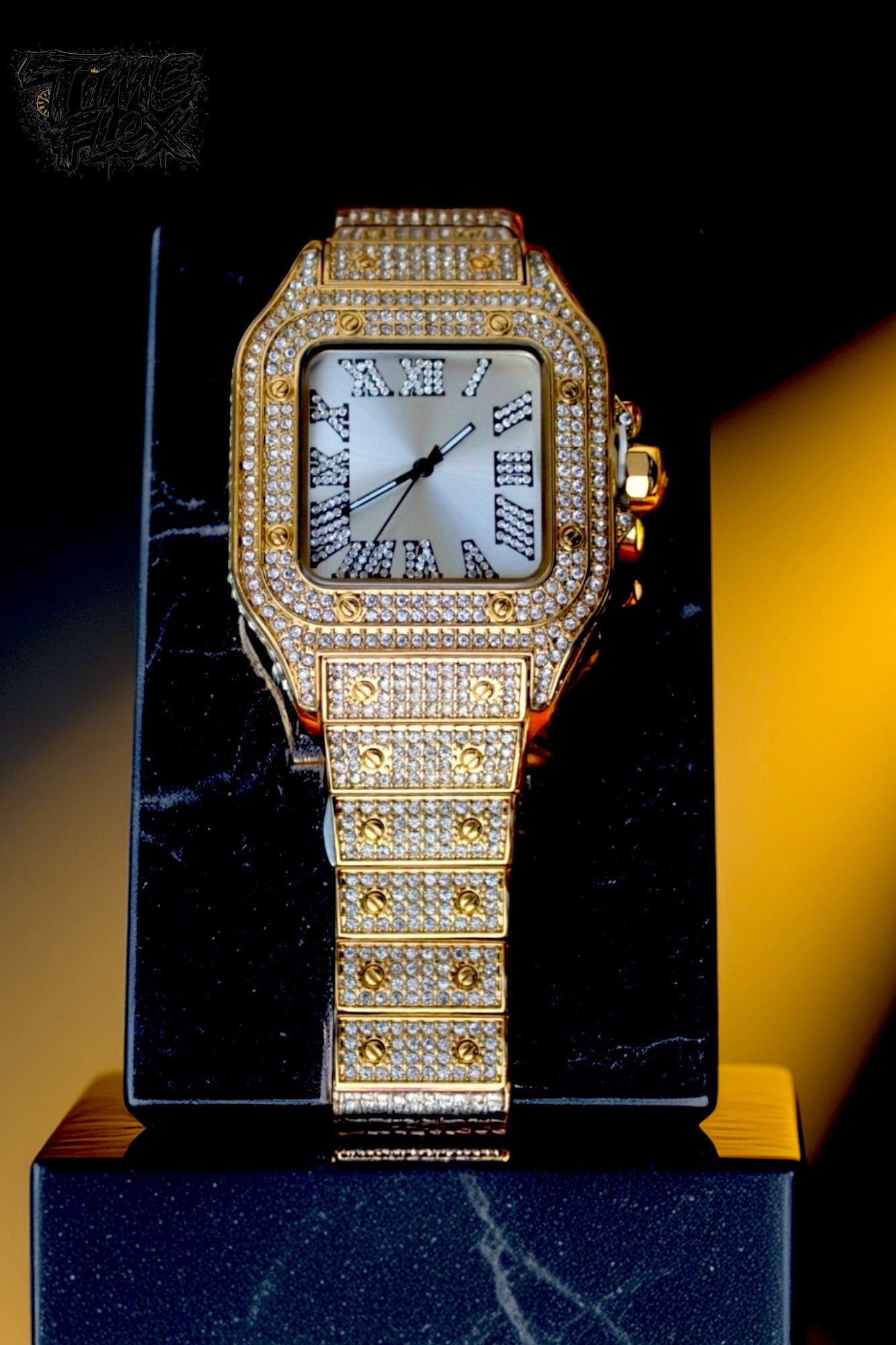 Gold-tone unisex watch with a square dial, diamond-studded bezel, and Roman numeral markers. The watch features a luxurious crystal-encrusted band, offering a sparkling and elegant design.