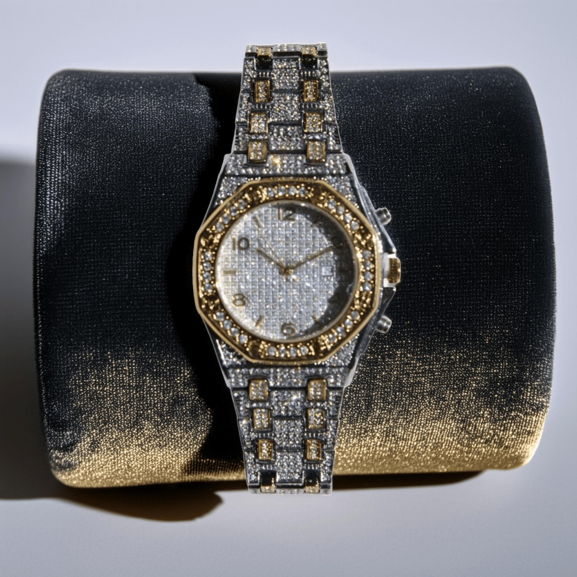 Iced-out two-tone watch with gold hex bezel, silver pavé dial, and chronograph details – urban luxury timepiece