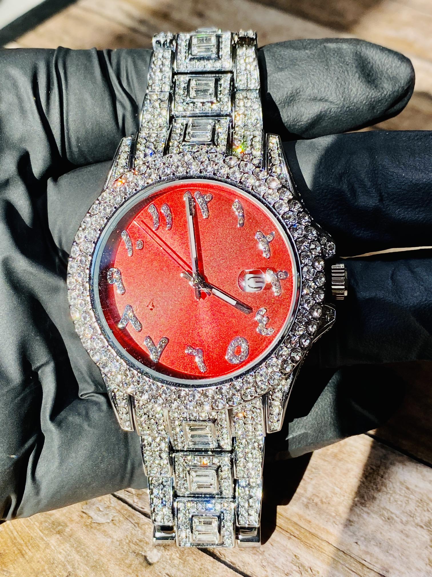 Silver iced-out watch with scarlet red dial, crystal markers, and baguette bracelet – luxury streetwear timepiece

