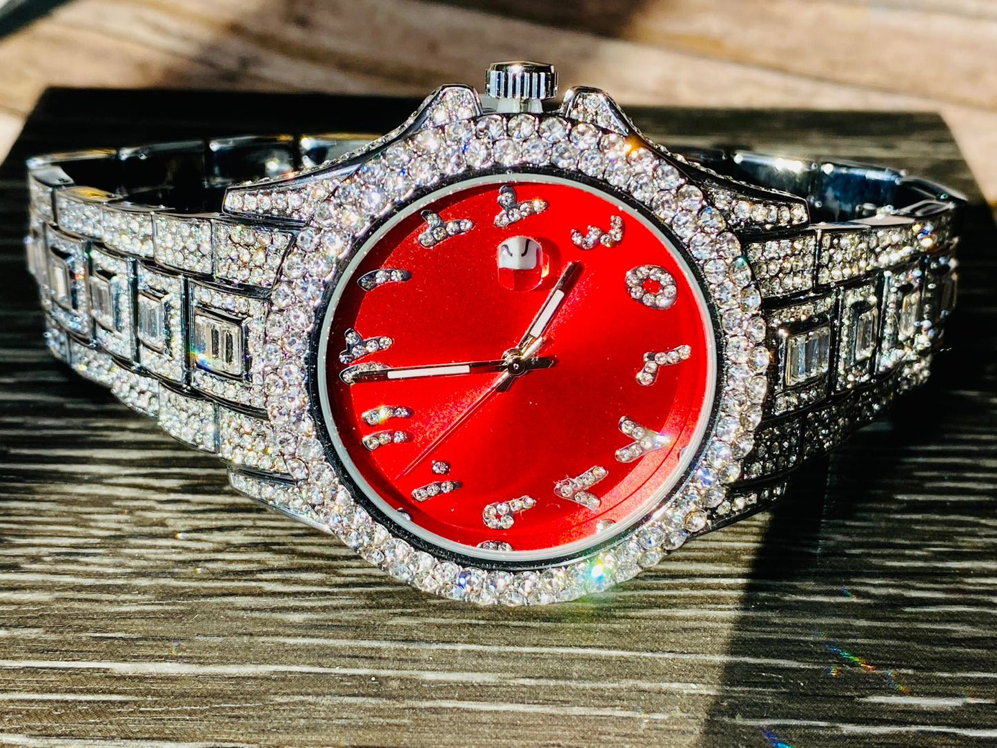 Silver iced-out watch with scarlet red dial, crystal markers, and baguette bracelet – luxury streetwear timepiece