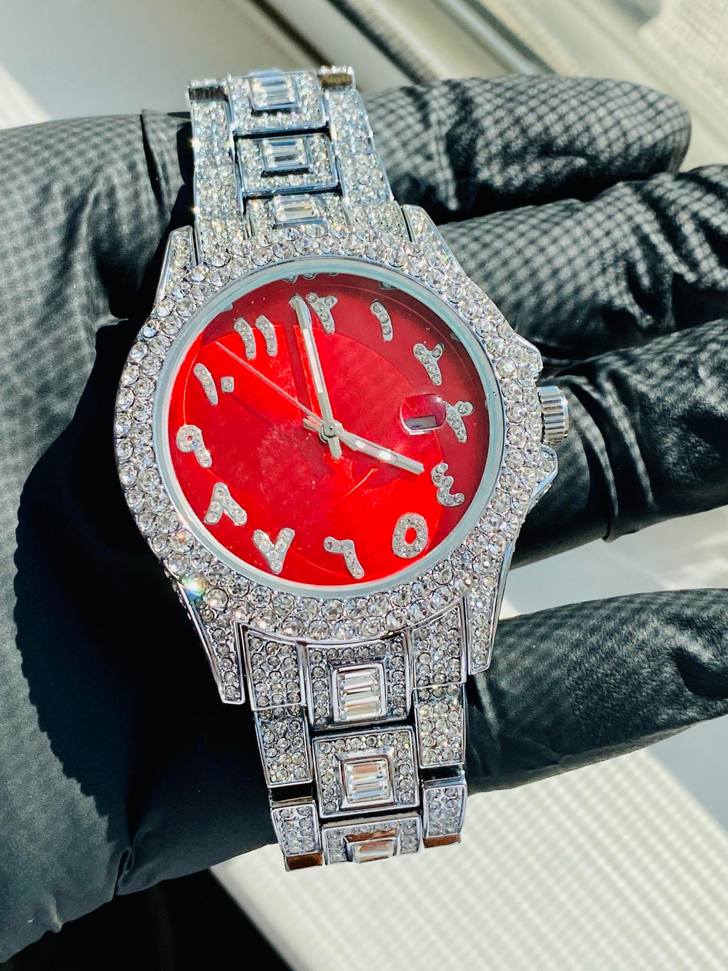 Silver iced-out watch with scarlet red dial, crystal markers, and baguette bracelet – luxury streetwear timepiece