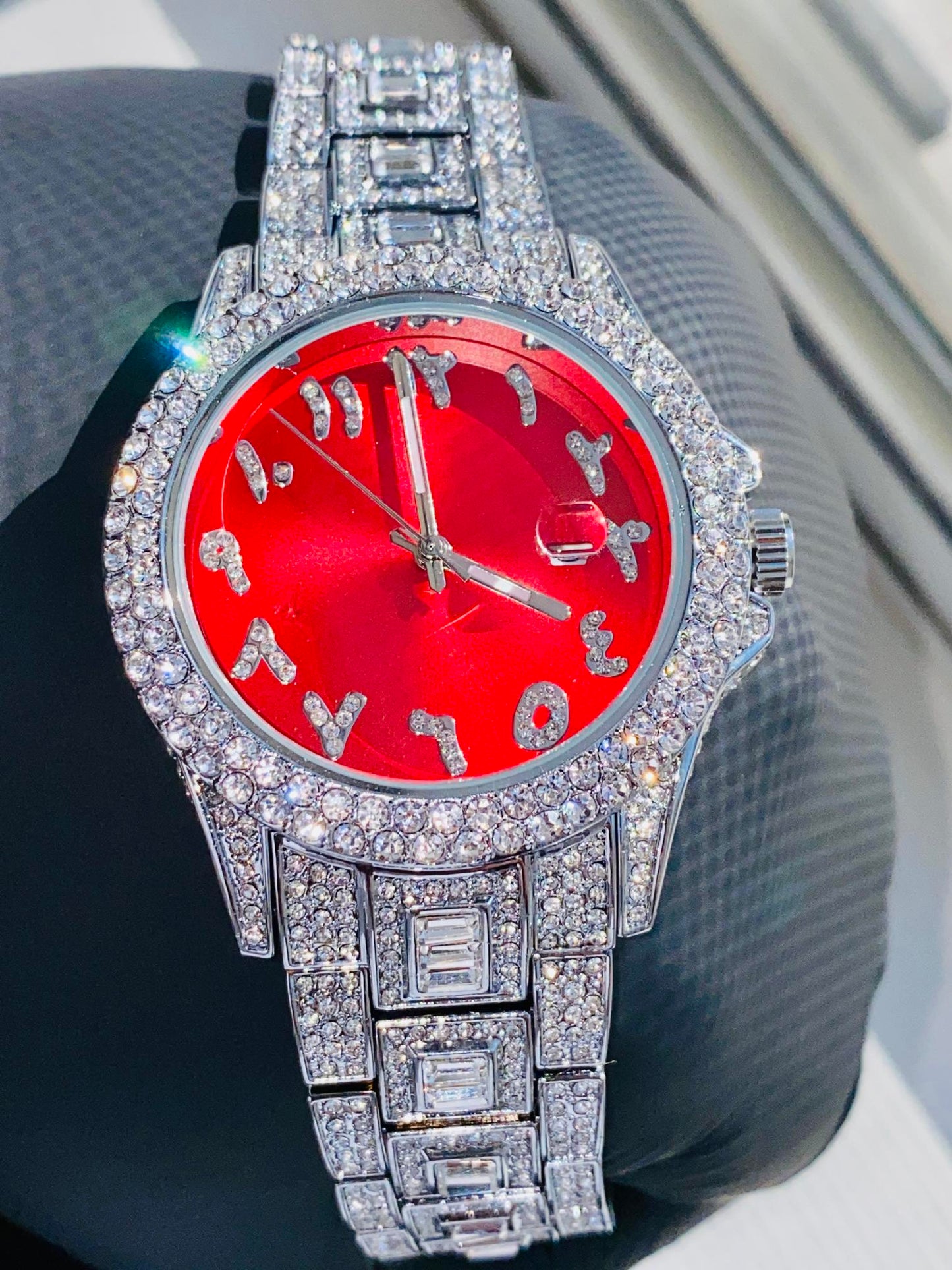 Silver iced-out watch with scarlet red dial, crystal markers, and baguette bracelet – luxury streetwear timepiece