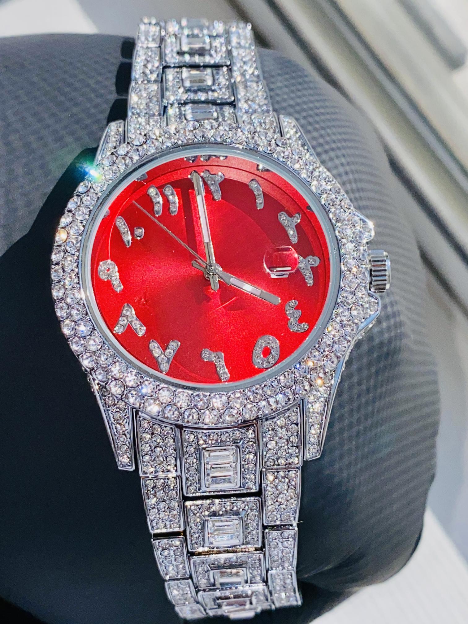 Silver iced-out watch with scarlet red dial, crystal markers, and baguette bracelet – luxury streetwear timepiece