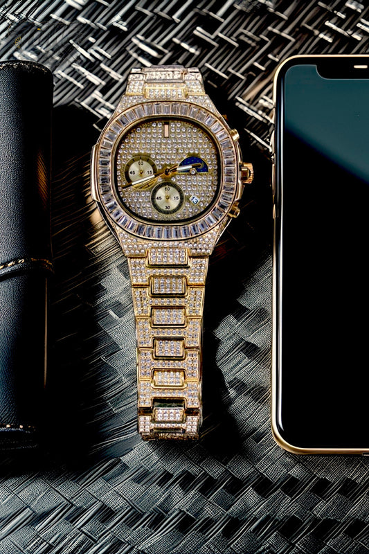Gold-tone unisex watch with a diamond-studded dial and bezel. The watch features dual sub-dials, a moonphase display, and a sparkling crystal-encrusted band, offering a luxurious and high-end look.
