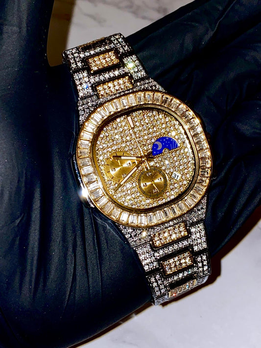 Two-tone iced-out watch with gold dial, moon phase complication, and baguette bezel – luxury diamond timepiece