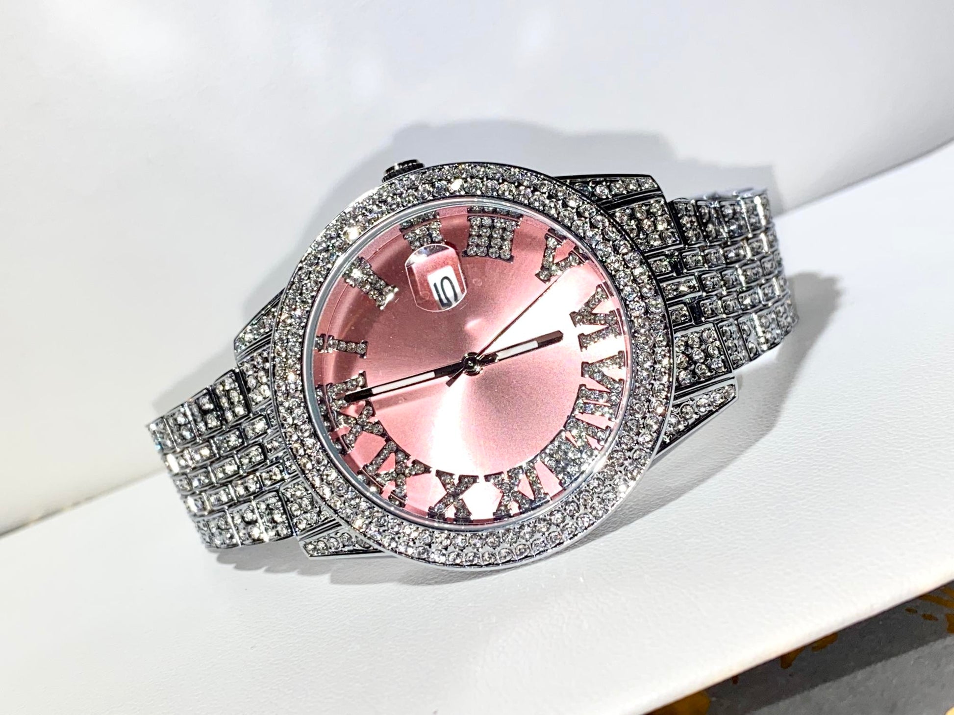 Rose gold Roman numeral iced watch with silver strap on white background – Rosé Royale 38MM by Time Flex