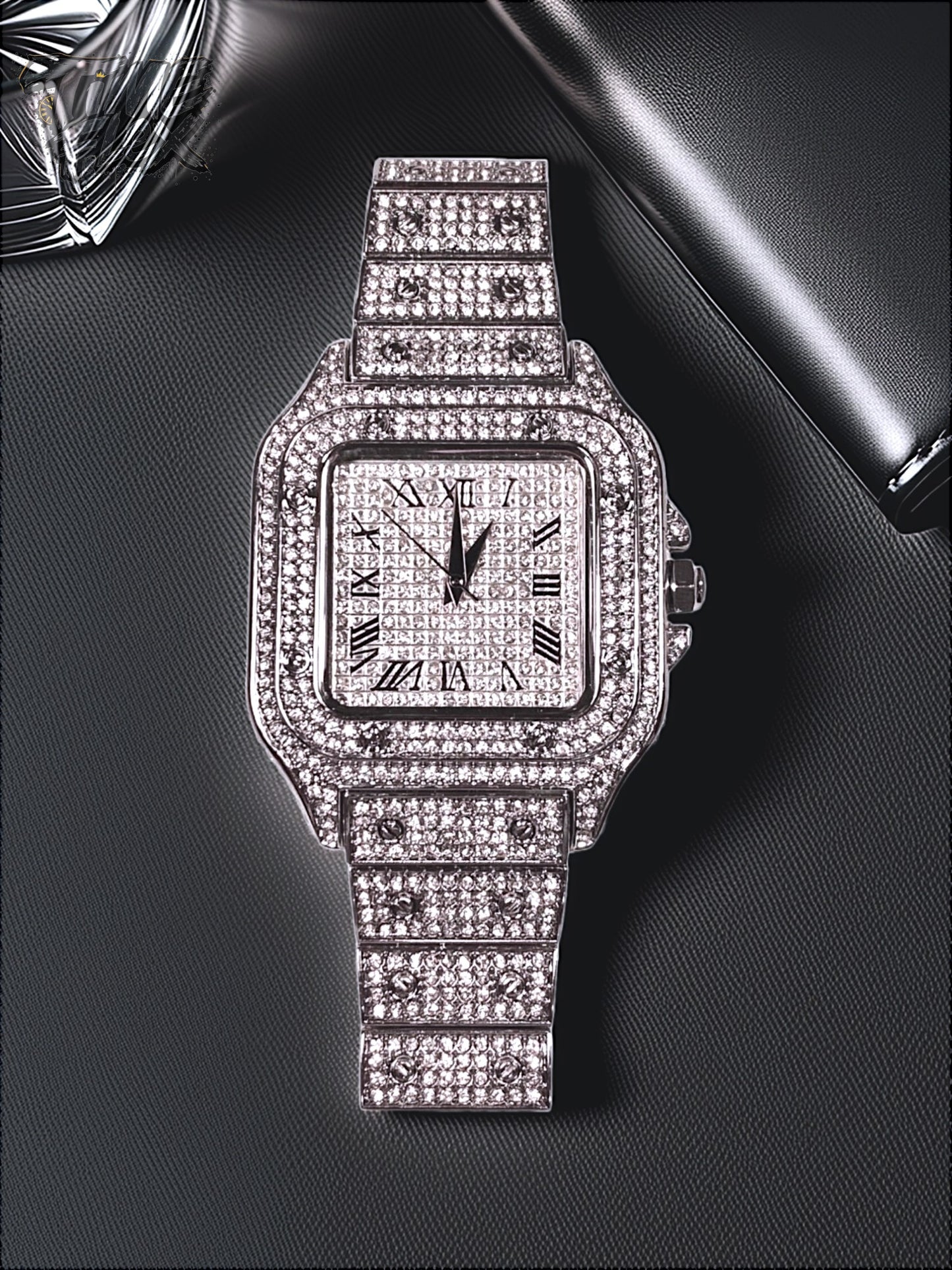 Silver-tone unisex watch with a square dial, crystal-encrusted bezel, and sparkling band. The watch features Roman numeral markers and a luxurious, diamond-studded design, offering a sleek and elegant look.