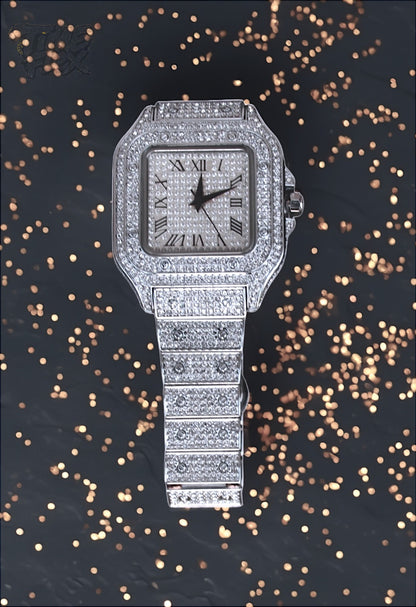 Silver-tone unisex watch with a square dial, crystal-encrusted bezel, and sparkling band. The watch features Roman numeral markers and a luxurious, diamond-studded design, offering a sleek and elegant look.