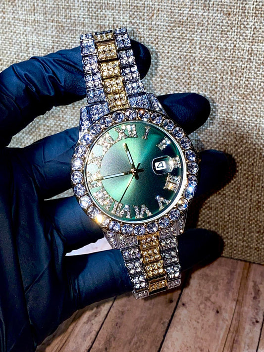 Two-tone iced-out watch with green Roman numeral dial and crystal bezel – luxury statement timepiece