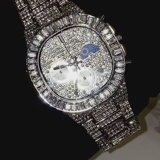 Silver iced-out chronograph watch with baguette bezel and moon phase dial – luxury diamond timepiece